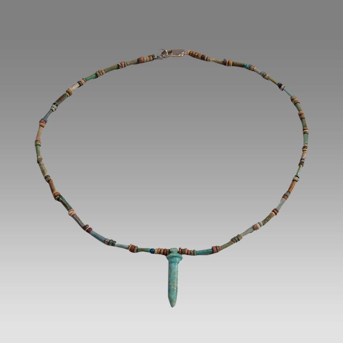 Ancient Egyptian Faience, Bead Necklace With Wadj Amulet c.700-30 BC.: Ancient Egyptian Faience, Bead Necklace With Wadj Amulet c.700-30 BC. Size 16 3/4 inches length. Great Looking single strand Faience Bead necklace with blue faience WADJ, Papyrus amulet. wearable. Pro