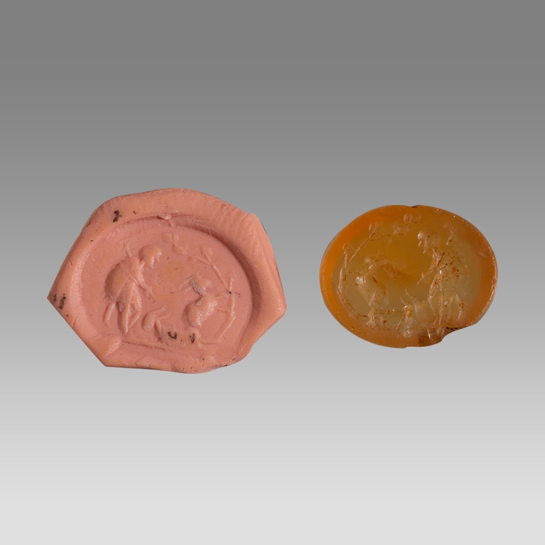 Ancient Roman carnelian Intaglio c.2nd century AD.: Ancient Roman carnelian Intaglio c.2nd century AD. Size 12 x 10 mm. Light orange translucent carnelian intaglio with sheperd clad in goat skin facing right, he is watching two goats, one resting on th