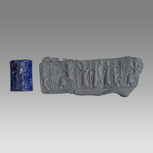 Mesopotamian Akkadian Style Lapis Lazuli Cylinder Seal With god Enlil.: Mesopotamian Akkadian Style Lapis Lazuli Cylinder Seal With god Enlil. Size 26 x 19 mm. Fine carved large Lapis Lazuli Cylinder seal with seated god Enlil pouring water or beer? facing four worshipers