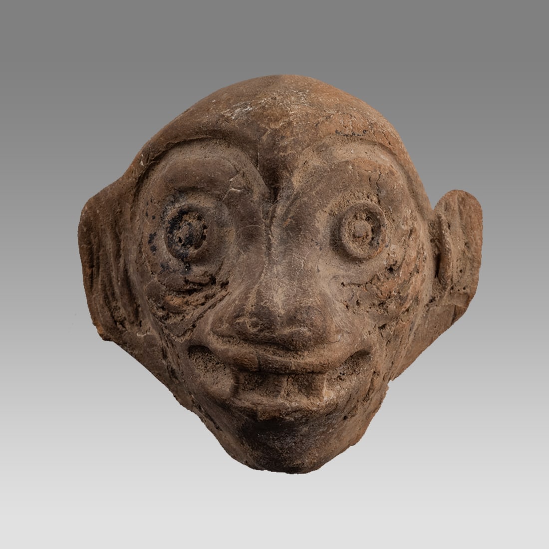 Ancient Pre-Colombian Jaguar Face with Fangs, Terracotta.: Ancient Pre-Colombian Jaguar Face with Fangs, Terracotta. Size 2 1/2 x 2 1/2 inches. Provenance: ex Ernest collection, ex Doubrava collection, ex Wilson Collection, by descent