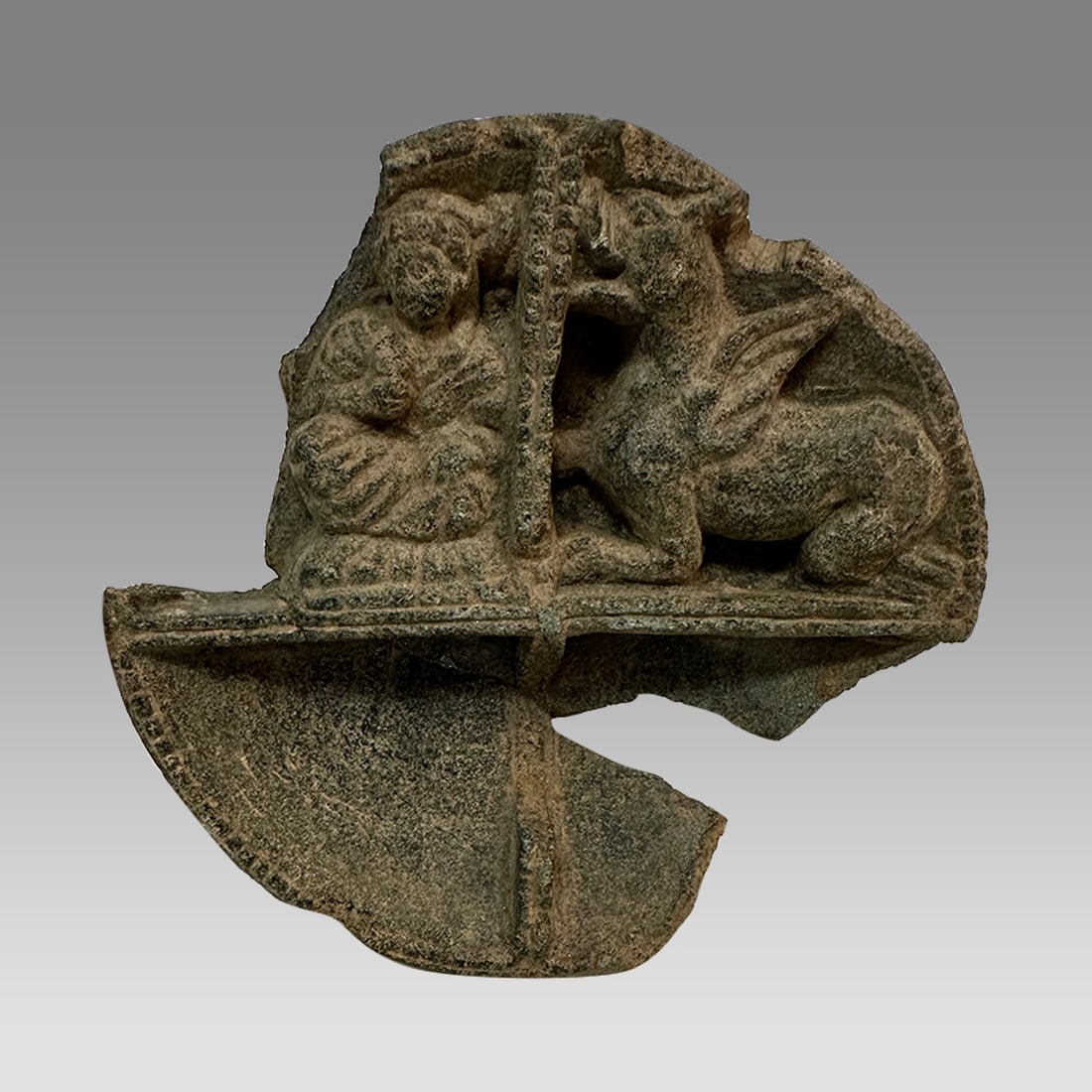 Ancient Gandhara Schist Stone Cosmetic Palette with Lion c.2nd century AD.: Ancient Gandhara Schist Stone Cosmetic Palette with Lion c.2nd century AD. Size 5 1/2 inches diameter, 1 inch. Rare Schist stone stele carved in high relief. Upper section with Lion with wings facing 