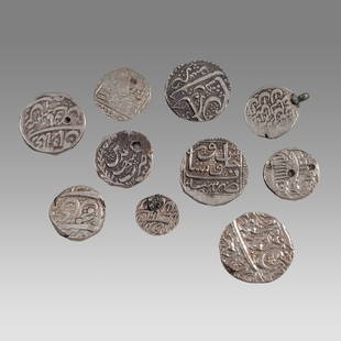 Lot of 10 Islamic India Mughal Silver Coins c.18th century.: Lot of 10 Islamic India Mughal Silver Coins c.18th century. Size 14-24 mm, A collection of 10 thick silver coins with insciptions. Provenance: From a NYC collection acquired in the 1960s