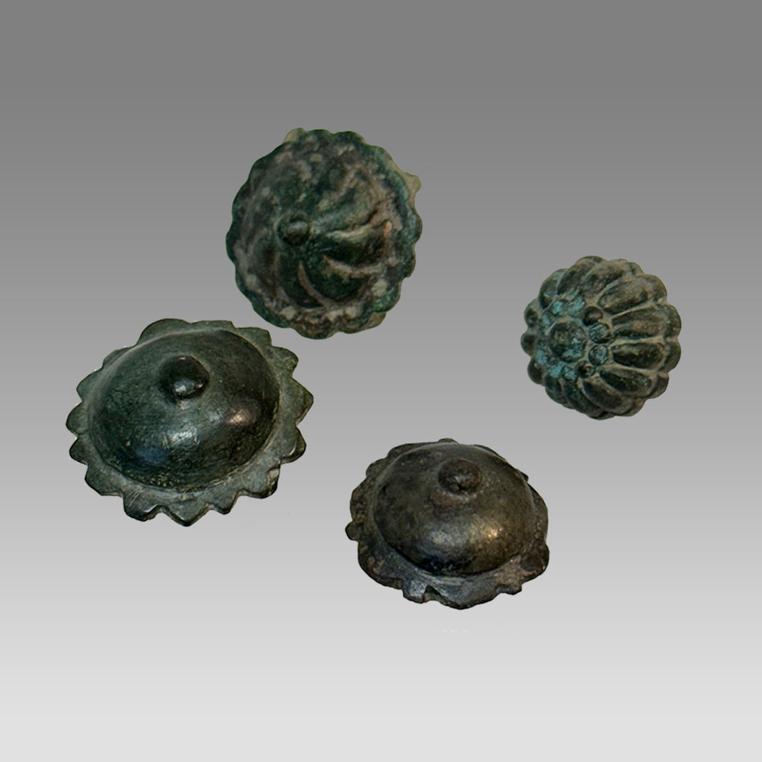 Lot of 4 Ancient Roman Bronze Armor Fittings c.2nd century AD.: Lot of 4 Ancient Roman Bronze Armor Fittings c.2nd century AD. Size 19-25 mm. Cast bronze Armor Fittings. Provenance: Collection of David Van Vleck, Jr of Brooklyn NY acquired 1990s