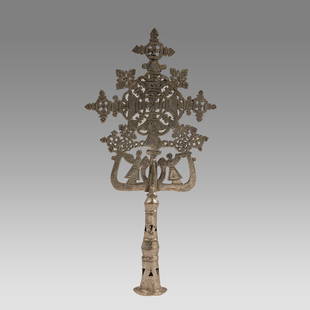 Ethiopian Coptic Processional Silvered Cross.: Ethiopian Coptic Processional Silvered Cross. Size 13 inches high, 6 1/2 inches wide. Cast and silvered brass cross, decorated on both sides, having an overall openwork Crosses decoration, two winged