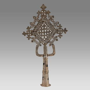 Ethiopian Coptic Processional Silvered Cross.: Ethiopian Coptic Processional Silvered Cross. Size 13 3/4 inches high, 7 1/2 inches wide. Cast and silvered brass cross, decorated on both sides, having an overall openwork geometric and Crosses decor