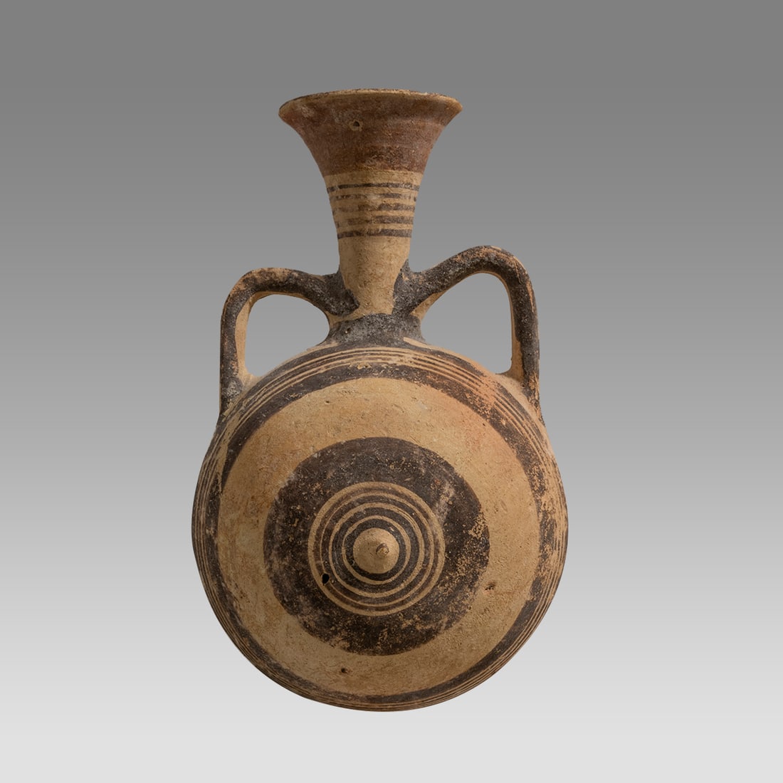 Ancient Cypriot Pottery Flask With Decoration c.700-600 B.C.: Ancient Cypriot Pottery Flask With Decoration c.700-600 B.C. Size 7 1/4 inches high, 4 1/2 inches widest point. Cypriot Flask with twin handles decorated with geometric circle patterns (Target like de