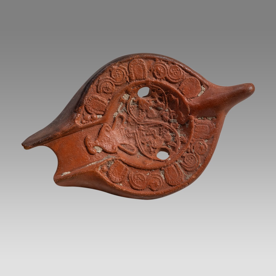 Ancient Roman North African Terracotta Oil Lamp Fragment c.2nd century AD.: Ancient Roman North African Terracotta Oil Lamp Fragment c.2nd century AD. Size 5 1/4 inches length. Fine Mold made red terracotta oil lamp fragment with Amphora and Ivy, a standing male figure holdin