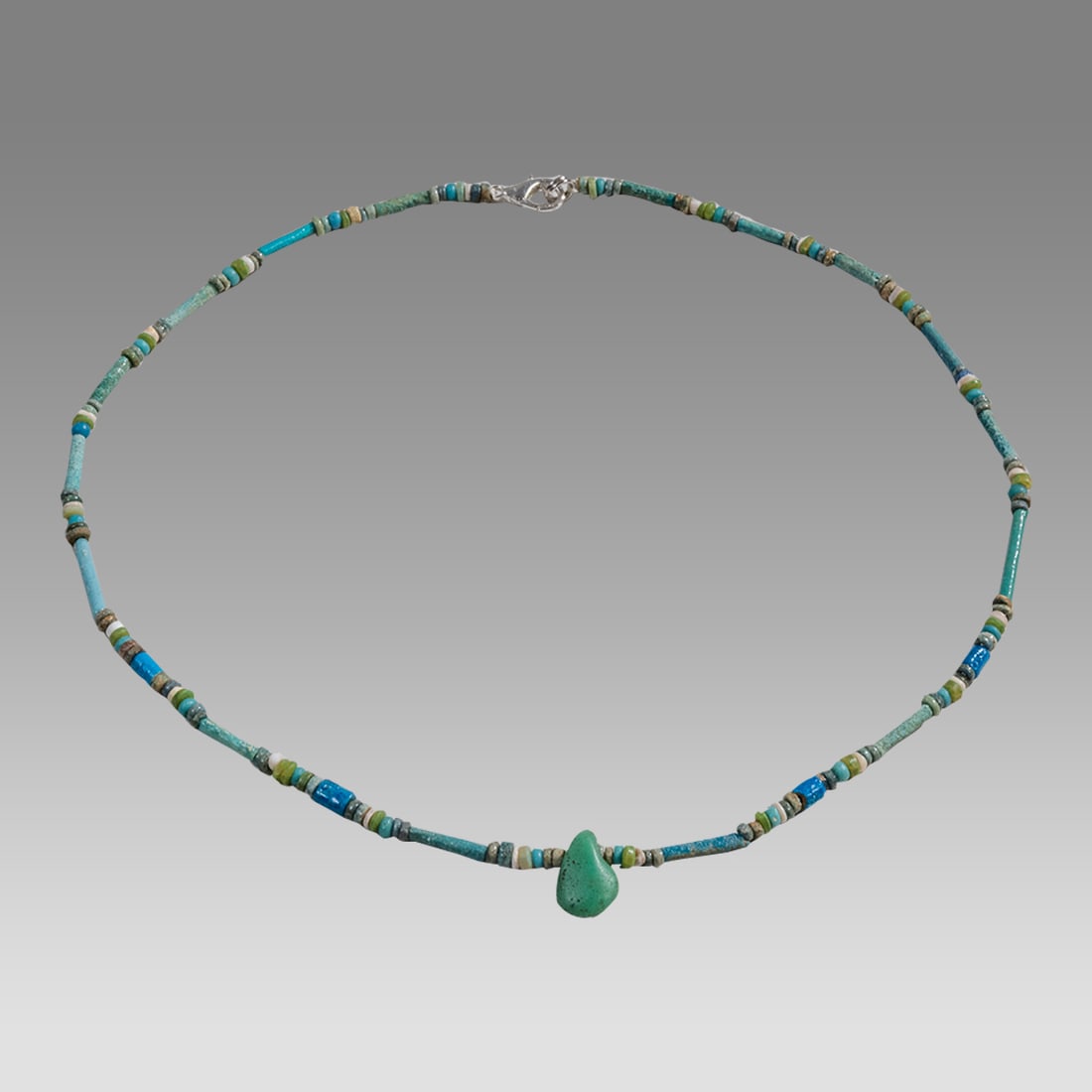 Ancient Egyptian Faience, Bead Necklace c.300-50 BC.: Ancient Egyptian Faience, Bead Necklace c.300-50 BC. Size 18 3/4 inches length. Great Looking single strand Faience Bead necklace with glass amulet. wearable. Provenance: Ex Secret Eyes Gallery New Yo