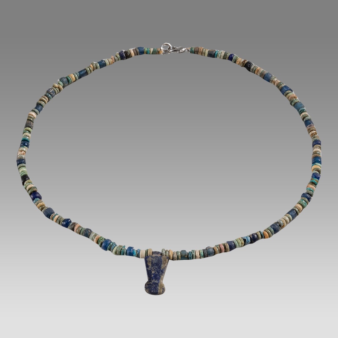Ancient Egyptian Faience, Bead Necklace c.300-50 BC.: Ancient Egyptian Faience, Bead Necklace c.300-50 BC. Size 16 1/2 inches length. Great Looking single strand Faience Bead necklace with Lapis Lazuli Crown amulet. wearable. Provenance: Ex Secret Eyes G