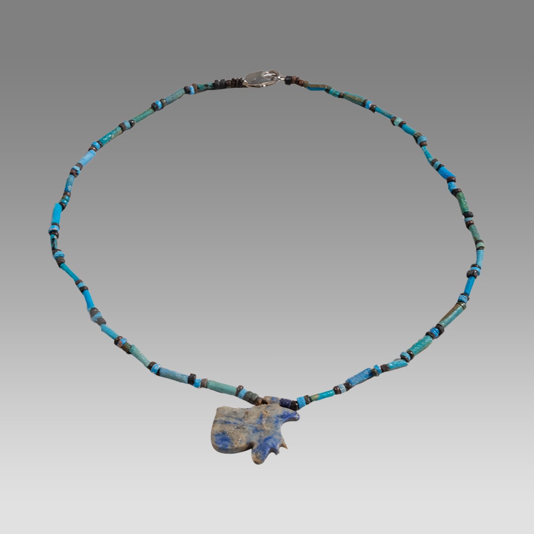 Ancient Egyptian Faience, Bead Necklace c.300-50 BC.: Ancient Egyptian Faience, Bead Necklace c.300-50 BC. Size 17 inches length. Great Looking single strand Faience Bead necklace with Lapis Lazuli Eye of Horus amulet. wearable. Provenance: Ex Secret Eye