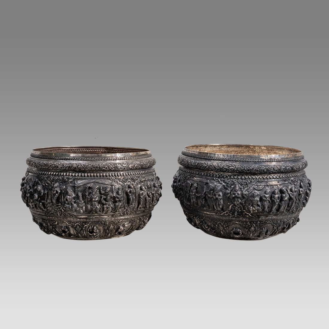 A large pair of Burmese silver bowls repoussed with six scenes. (1 of 10)