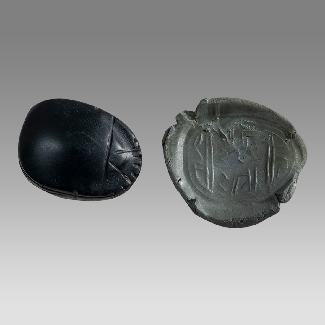 Holyland, Phoenician Dark Stone Scarab Seal.: Holyland, Phoenician Dark Stone Scarab Seal. Size 21 x 14 mm. Carved dark green stone Scarab seal in the Phoenician Style: Phoenician Inscription. hole through for suspension. Age unknown. Provenance: