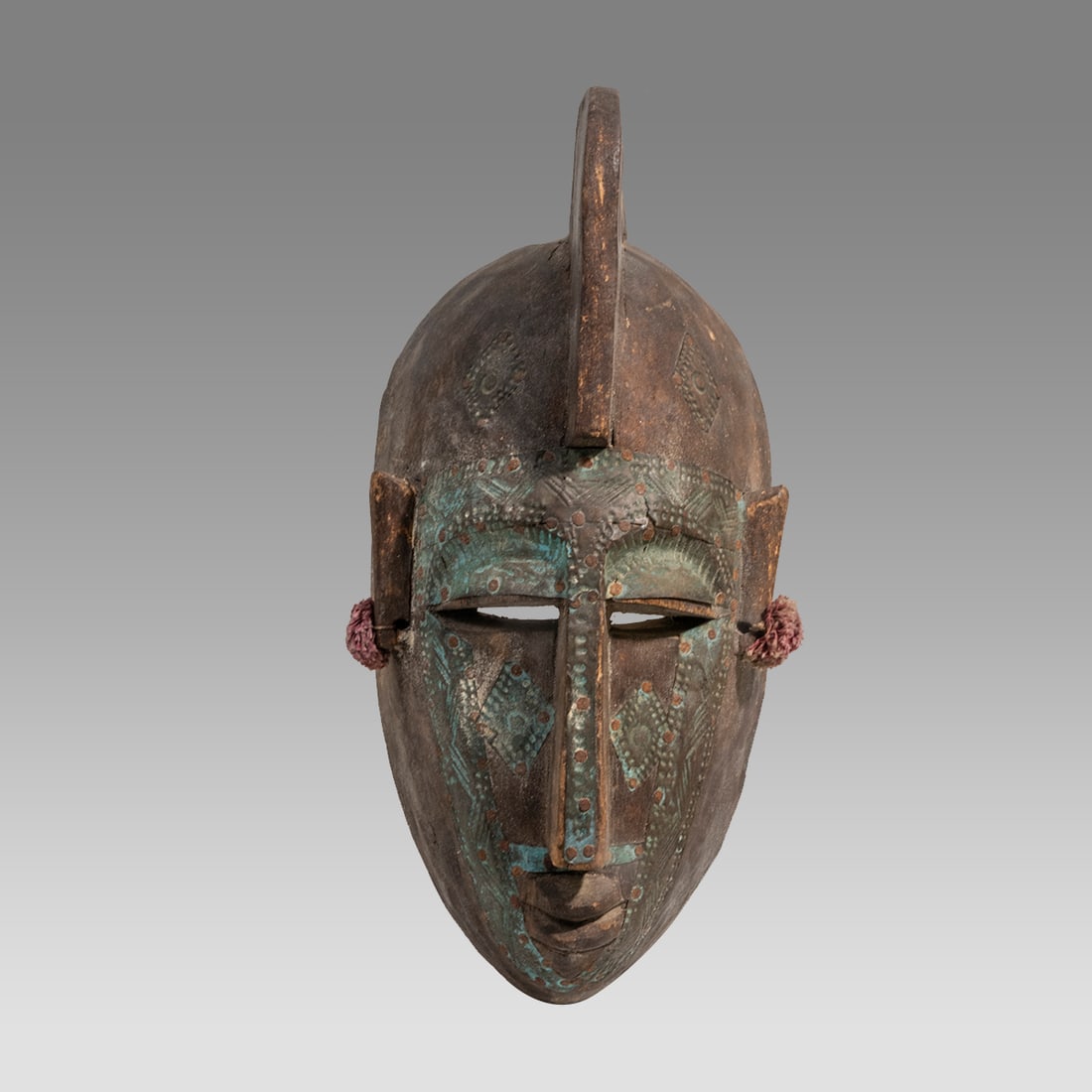 African, Ivory Coast Wood Mask.: African, Ivory Coast Wood Mask. Size 13 1/4 inches high, 6 inches wide. Large carved wood mask with metal or copper on face decorated with engraved design. Provenance: Ex Secret Eyes Gallery New York 