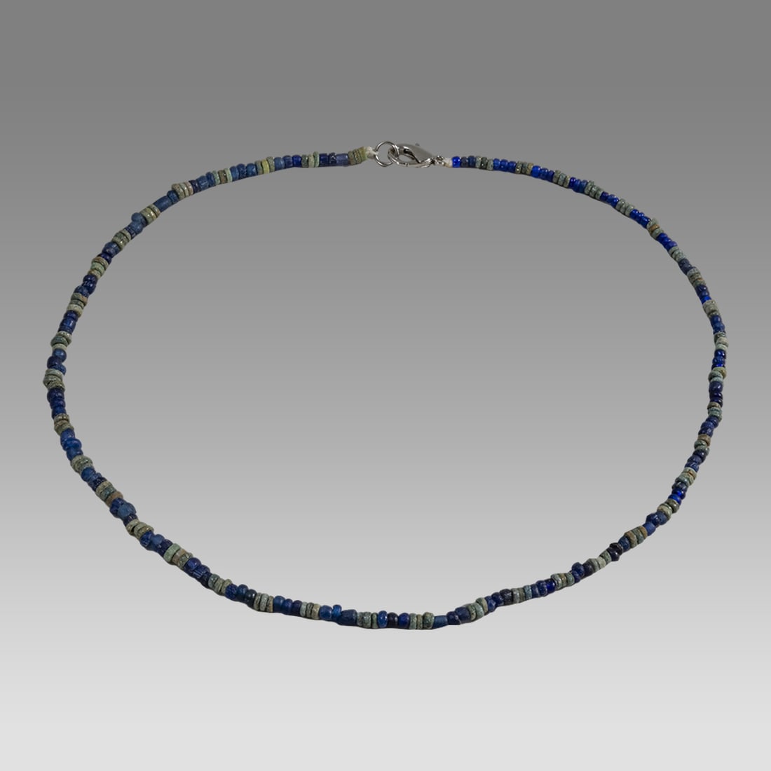 Ancient Egyptian Faience, Bead Necklace c.300-50 BC.: Ancient Egyptian Faience, Bead Necklace c.300-50 BC. Size 18 inches length. Great Looking single strand Faience Bead, mixed with blue glass beads necklace. wearable. Provenance: Ex Secret Eyes Gallery