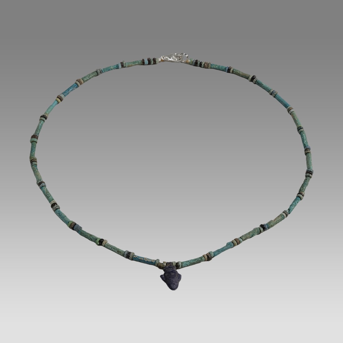 Ancient Egyptian Faience, Bead Necklace c.300-50 BC.: Ancient Egyptian Faience, Bead Necklace c.300-50 BC. Size 17 1/2 inches length. Great Looking single strand Faience Bead necklace. With Lapis Lazuli Heart amulet. wearable. Provenance: Ex Secret Eyes 
