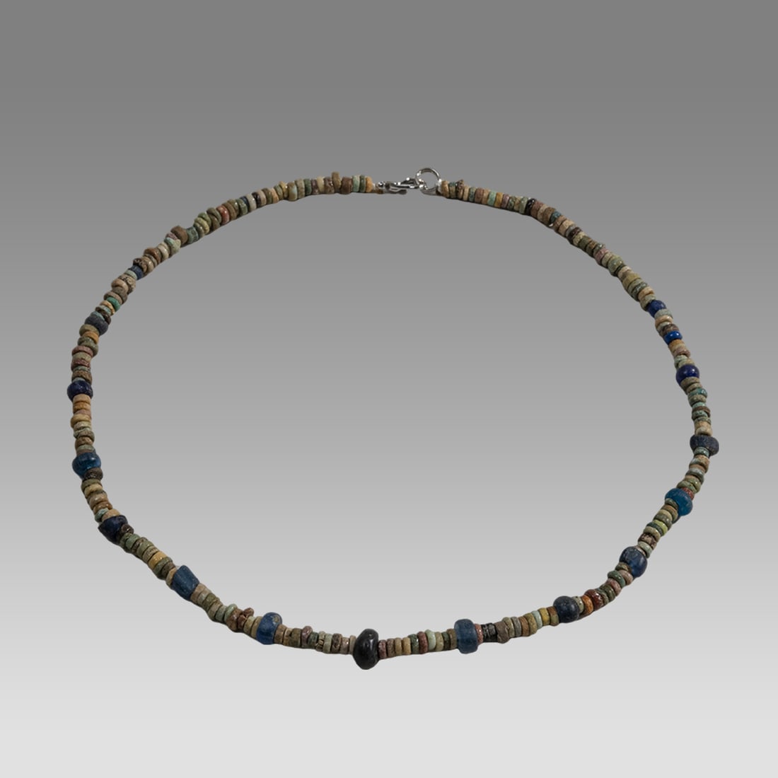 Ancient Egyptian Faience, Bead Necklace c.300-50 BC.: Ancient Egyptian Faience, Bead Necklace c.300-50 BC. Size 16 1/2 inches length. Great Looking single strand Faience Bead necklace. Mixed with roman glass beads. wearable. Provenance: Ex Secret Eyes Ga