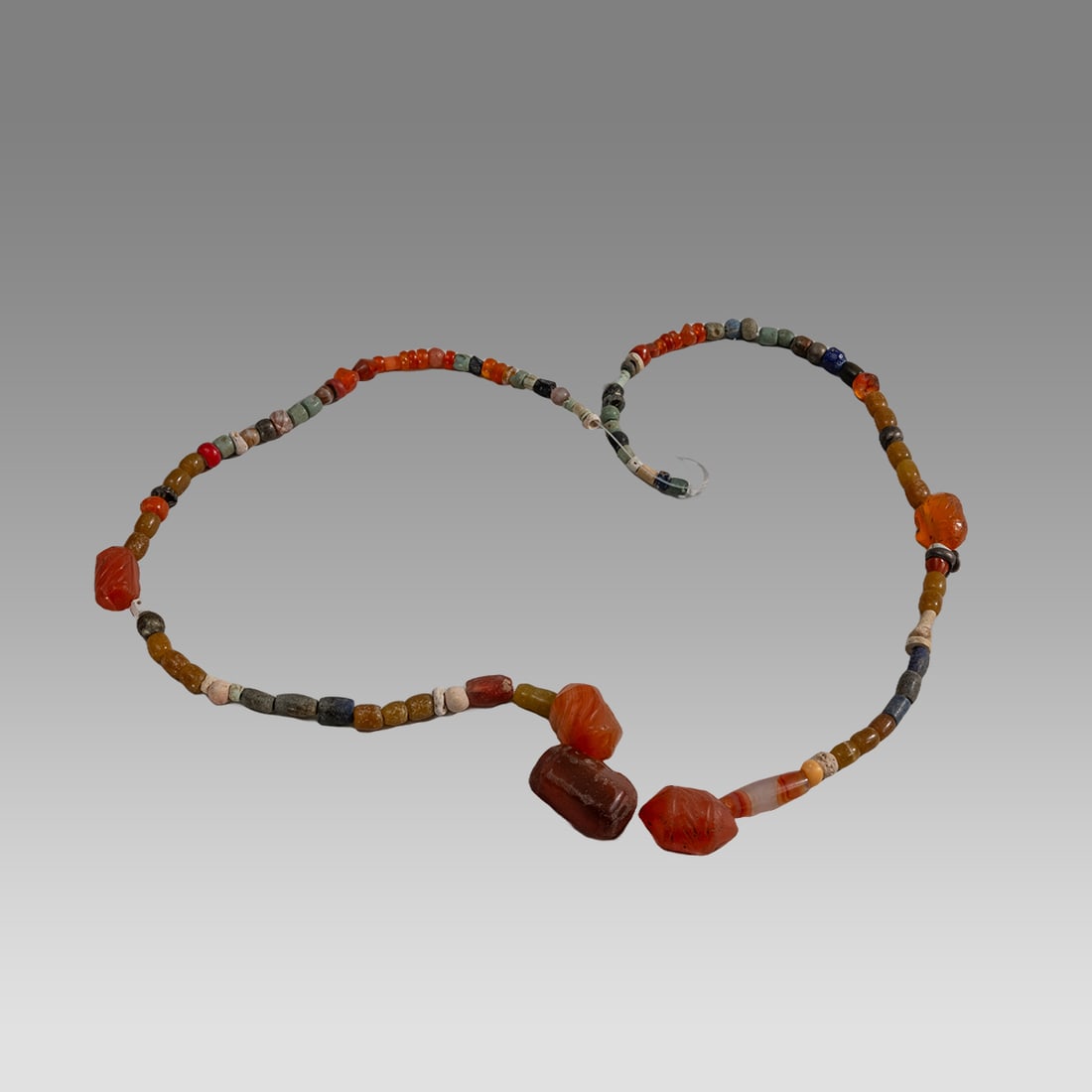 Ancient Roman/Islamic Stone, Glass Beads Necklace c.1st-8th century AD.: Ancient Roman/Islamic Stone, Glass Beads Necklace c.1st-8th century AD. Size 19 inches length. Ancient stone and glass beads from Ancient Roman to Islamic period. Provenance: From a NYC collection acq