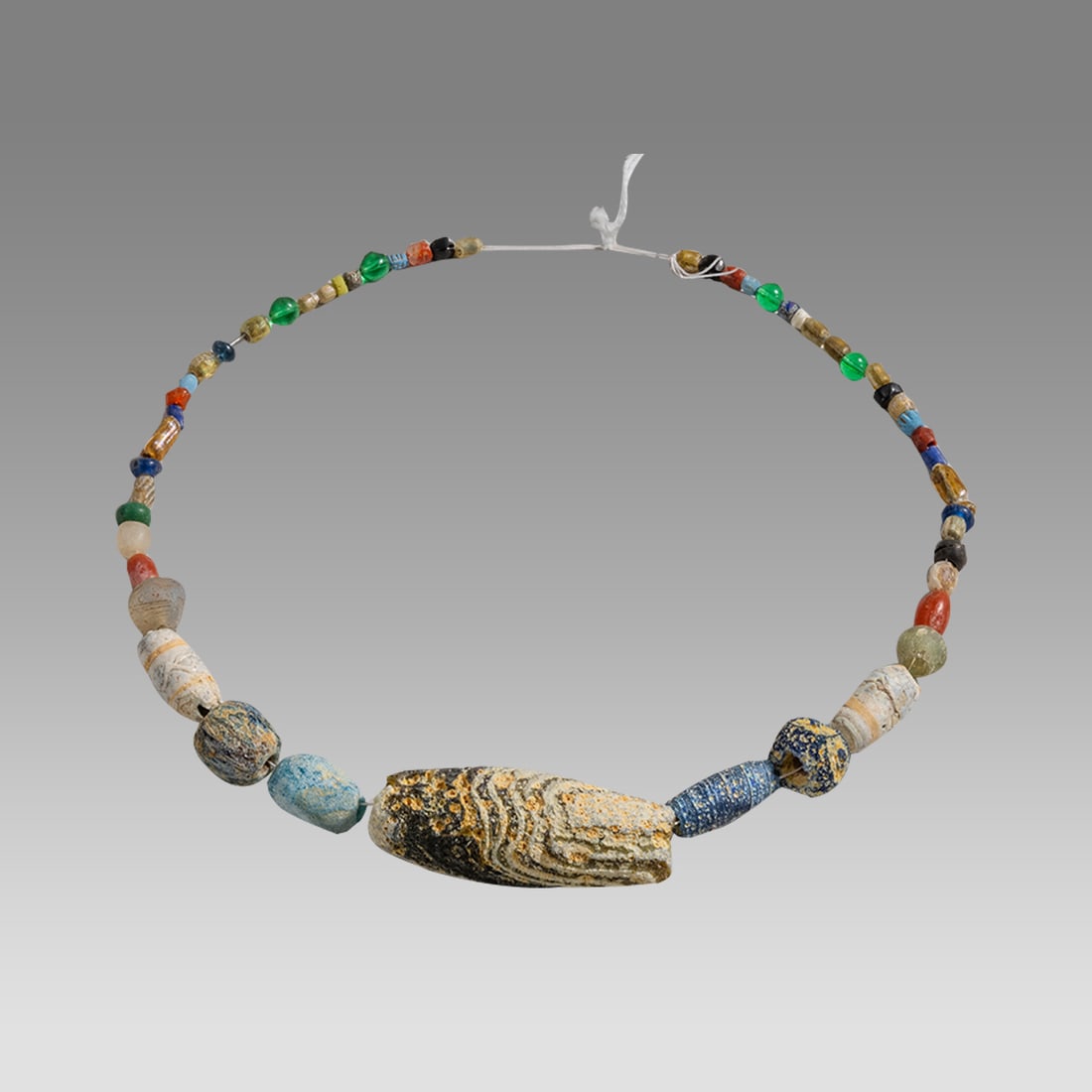 Ancient Roman/Islamic Glass Beads Necklace c.1st-8th century AD.: Ancient Roman/Islamic Glass Beads Necklace c.1st-8th century AD. Size 16 inches length. Ancient glass beads from Ancient Roman to Islamic period. Provenance: From a NYC collection acquired in the 1960