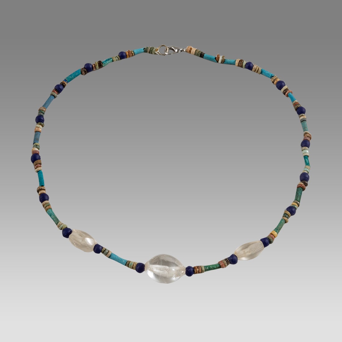 Ancient Egyptian Faience, Bead Necklace c.300-50 BC.: Ancient Egyptian Faience, Bead Necklace c.300-50 BC. Size 17 inches length. Great Looking single strand Faience Bead necklace with large crystal beads of later period. wearable. Provenance: Ex Secret 