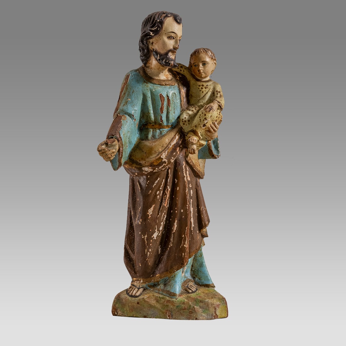 Spanish Colonial Wood Figure of Saint Joseph and Baby Jesus.: Spanish Colonial Wood Figure of Saint Joseph and Baby Jesus. Size 11 7/8 inches high. Colony of philippines. Polychrome figure of Saint Joseph holding baby Jesus.Early 2oth century.