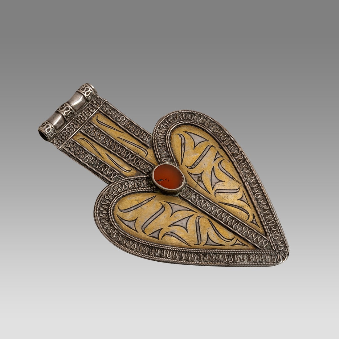 Small Tekke Turkoman Asyk In good silver with carnelian inset. (1 of 2)