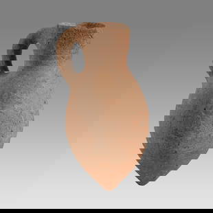 Ancient Holy Land Bronze Age Pottery Jug c.2100 BC.: Ancient Holy Land Bronze Age Pottery Jug c.2100 BC. Size 5 inches high.+ stand. A pottery jug with loop type handle having a spout with pointy base. Custom stand. Provenance: From The estate of Rev.