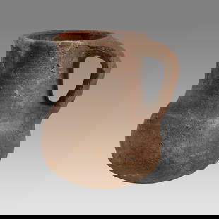 Ancient Holy Land Iron Age Pottery Jug c.1400 BC.: Ancient Holy Land Iron Age Pottery Jug c.1400 BC. Size 4 3/4 inches high. A pottery jug with loop type handle having a large round spout with flat base. Custom ring stand. Provenance: From The estate