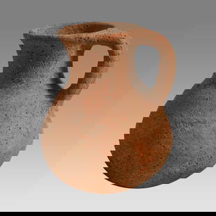 Ancient Holy Land Iron Age Pottery Jug c.1400 BC.: Ancient Holy Land Iron Age Pottery Jug c.1400 BC. Size 4 1/2 inches high. A pottery jug with loop type handle having a large round spout with round base. Custom ring stand. Provenance: From The