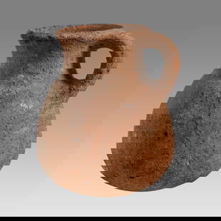 Ancient Holy Land Iron Age Pottery Jug c.1400 BC.: Ancient Holy Land Iron Age Pottery Jug c.1400 BC. Size 6 inches high. A pottery jug with loop type handle having a large round spout with round base. Custom ring stand. Provenance: From The estate of