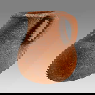 Ancient Holy Land Iron Age Pottery Jug c.1400 BC.: Ancient Holy Land Iron Age Pottery Jug c.1400 BC. Size 6 1/2 inches high. A pottery jug with loop type handle having a large round spout with round base. Custom ring stand. Provenance: From The