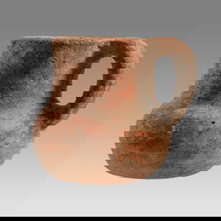 Ancient Holy Land Iron Age Pottery Jug c.1000 BC.: Ancient Holy Land Iron Age Pottery Jug c.1000 BC. Size 2 3/4 inches high. A small pottery jug with loop type handle having a large round spout with flat base. Provenance: From The estate of Rev.