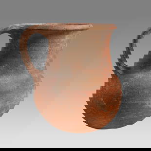 Ancient Holy Land Iron Age Pottery Jug c.1400 BC.: Ancient Holy Land Iron Age Pottery Jug c.1400 BC. Size 4 1/4 inches high. A pottery jug with loop type handle having a large round spout with round base. Custom ring stand. Provenance: From The