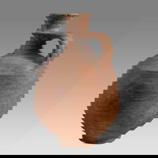 Ancient Holy Land Iron Age Pottery Jug c.1100 BC.: Ancient Holy Land Iron Age Pottery Jug c.1100 BC. Size 9 1/4 inches high. A large pottery jug with loop type strap handle with ring base. Provenance: From The estate of Rev. Boyce M. Bennett, THD,