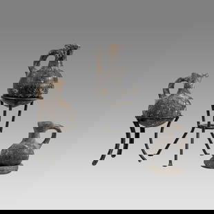 Lot of 3 Ancient Holy Land Iron Age Pottery Jugs c.1000 BC.: Lot of 3 Ancient Holy Land Iron Age Pottery Jugs c.1000 BC. Size 2 1/2 - 3 3/8 inches high. + stand. A collection of 3 small black pottery jug with loop type handle, round base. Iron Age burnished