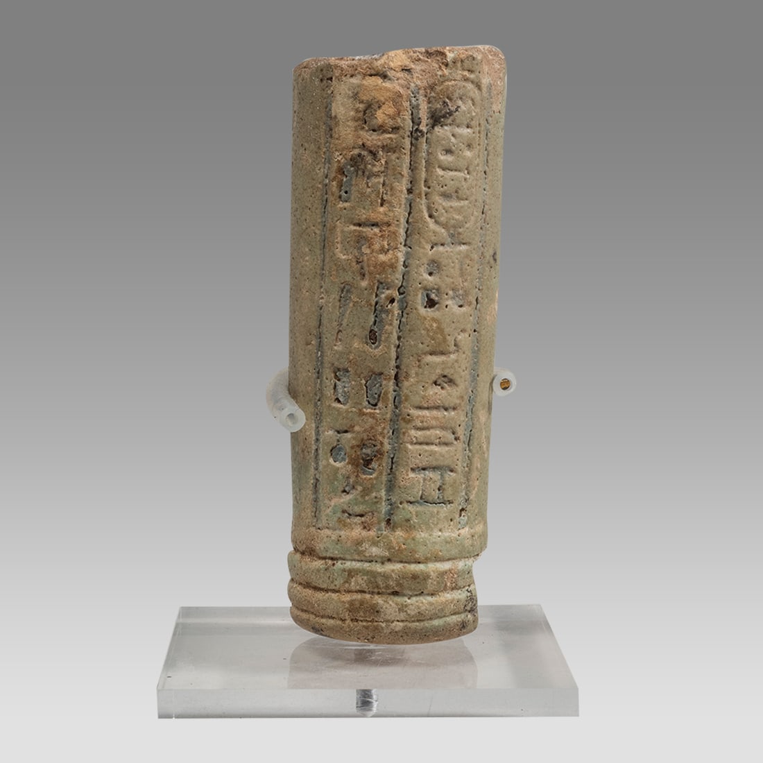 Ancient Egyptian Faience Handle with Hieroglyph 26th Dynasty c.664–525 B.C.: Ancient Egyptian Faience Handle with Hieroglyph 26th Dynasty c.664–525 B.C. Size 3 1/8 inch high + stand (8 cm) Light blue faience Sistrum handle with vertical lines of Hieroglyphic text on both sid