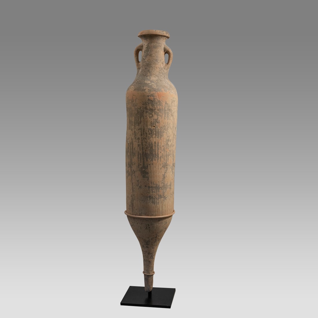 Ancient Roman Large Terracotta Wine Amphora c.1st-4th Century AD.: Ancient Roman Large Terracotta Wine Amphora c.1st-4th Century AD. Size 41 1/2 inches high. + stand. Very large thick walled Roman terracotta traposportation Amphora, cylindrical form with twin handle.