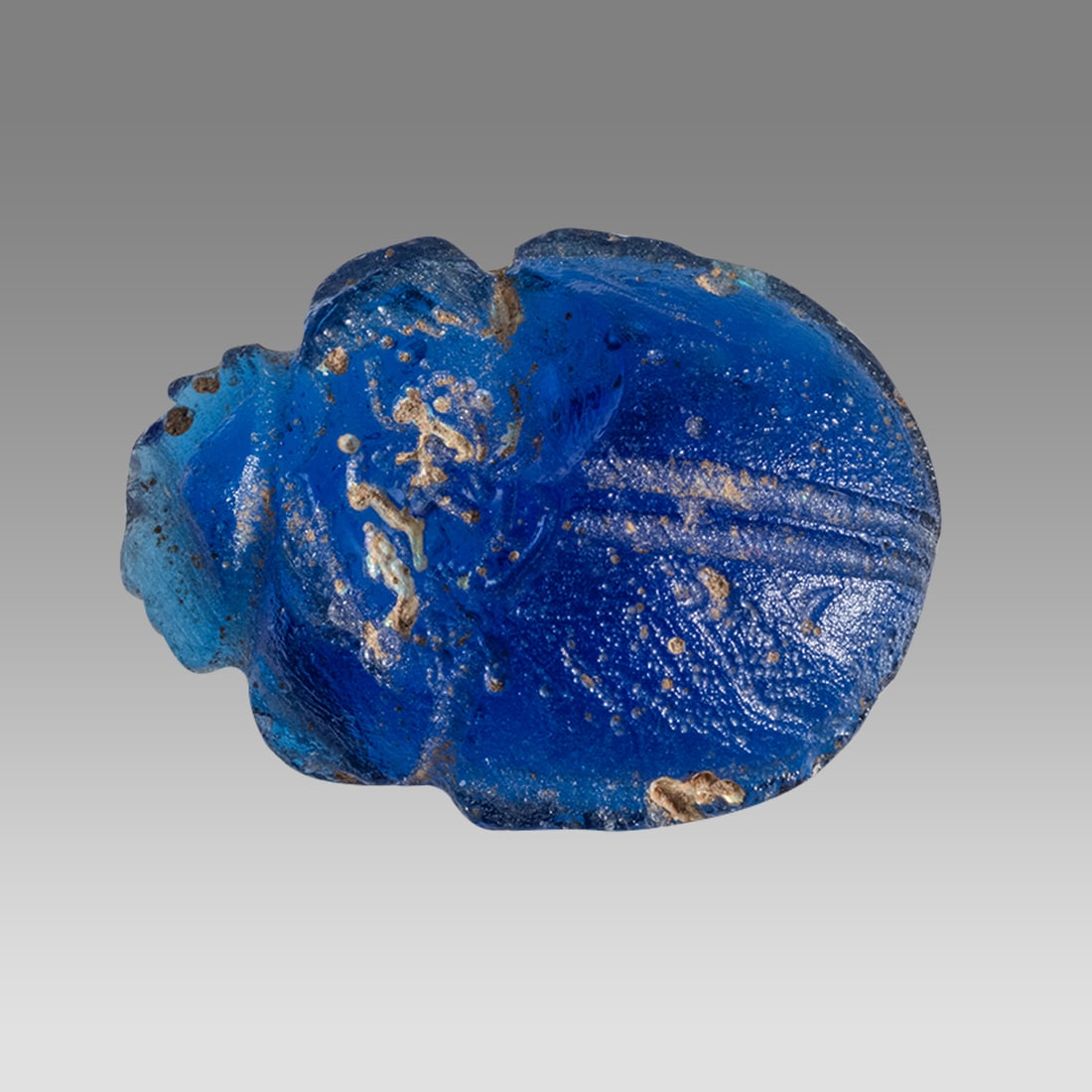 Ancient Egypt, Late Period Blue Glass Scarab c.634--330 BC.: Ancient Egypt, Late Period Blue Glass Scarab c.634--330 BC. Size 23 x 16 mm. Large blue glass scarab. Provenance: From A Private St Louis, MO Doctor collection, acquired from Michael F. Gorski, Indian
