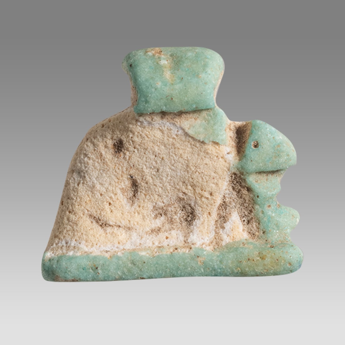 Ancient Egyptian Faience Green Faience Ante eater Amulet c.663-525 BC.: Ancient Egyptian Faience Green Faience Ante eater Amulet c.663-525 BC. Size 18 x 15 mm. Fine green faience ante eater amulet, suspension loop at top. Provenance: Ex Secret Eyes Gallery New York 1970's