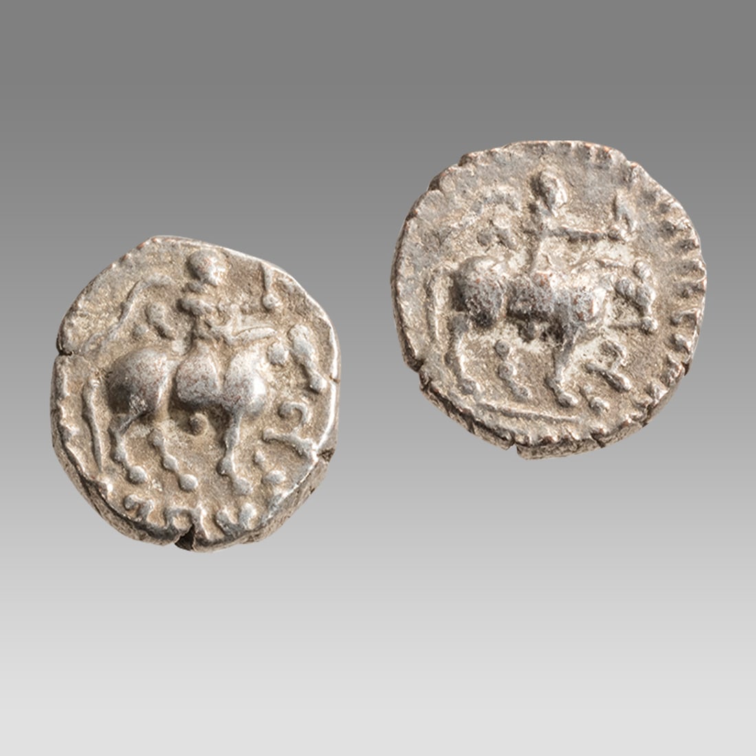 Lot of 2 Indo-Greek Silver Drachms Aziz II c.35-12 BC.: Lot of 2 Indo-Greek Silver Drachms Aziz II c.35-12 BC. Size 13-14 mm, weight 2.32- 2.56 grams. King on horse right, holding spear, Greek legend around. Reverse, Zeus standing facing left, monogram at 