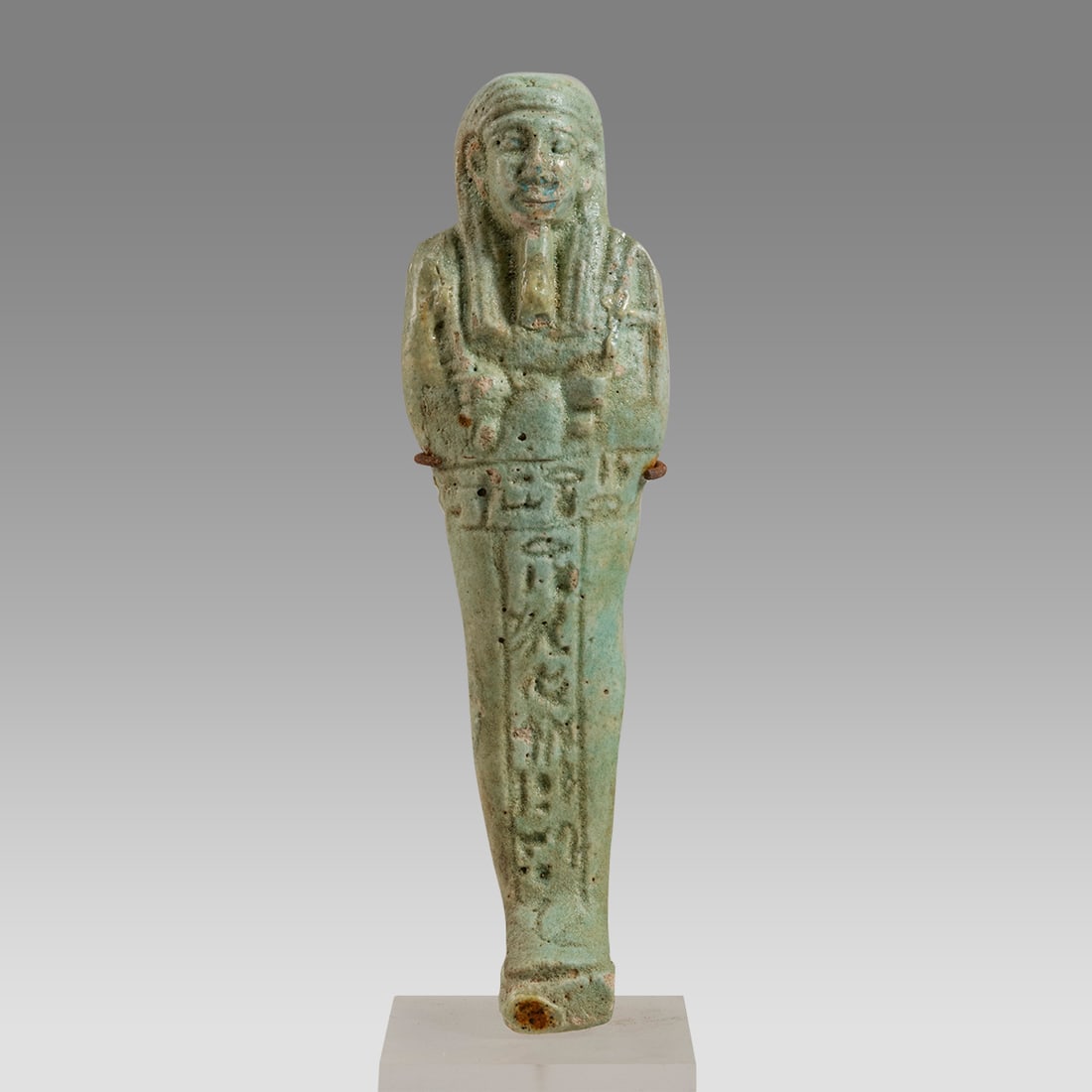 Ancient Egyptian Green Faience Ushabti Late period c.664-332 BC.: Ancient Egyptian Green Faience Ushabti Late period c.664-332 BC. Size 5 3/4 inches high. + mount. Late Period, 26th Dynasty, ca. 664 to 332 BCE. Green faience ushabti, mummiform figure standing on rec