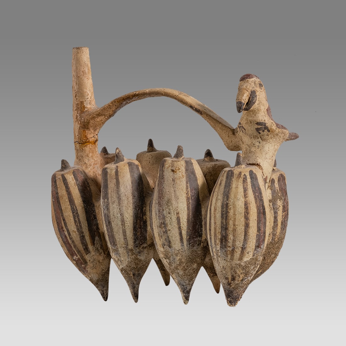 Ancient Pre Columbian Chancay Stirrup Parrot Vessel c.800-1200 AD.: Ancient Pre Columbian Chancay Stirrup Parrot Vessel c.800-1200 AD. Size 7 7/8 inches high, 7 inches wide. Unusual 8 chambered vessel with Parrot and a bridge handle joining both the aparrot and the sp