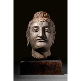 A Gandharan Carved Grey Schist Stone head of Buddha. Probably 2nd century AD.