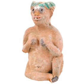 Mesopotamian style terracotta idol of characteristically abstract form depicting a seated female