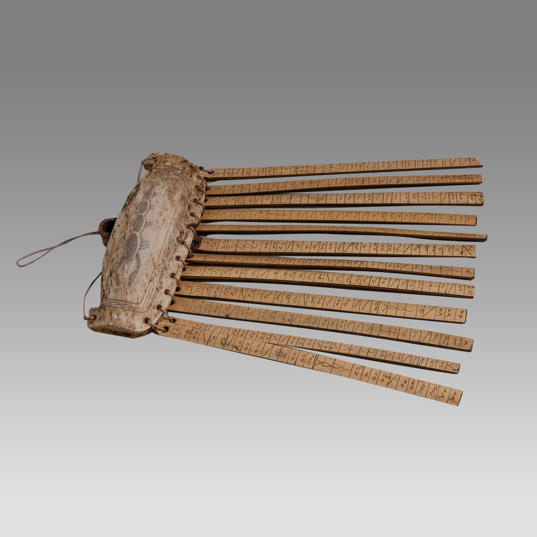 Indonesian Divining Talisman.: Indonesian Divining Talisman. Size 7 1/2 inches length, 4 5/8 inches wide. Carved bone with bamboo. Private NYC collection, ex. Joe Gerena, NYC.