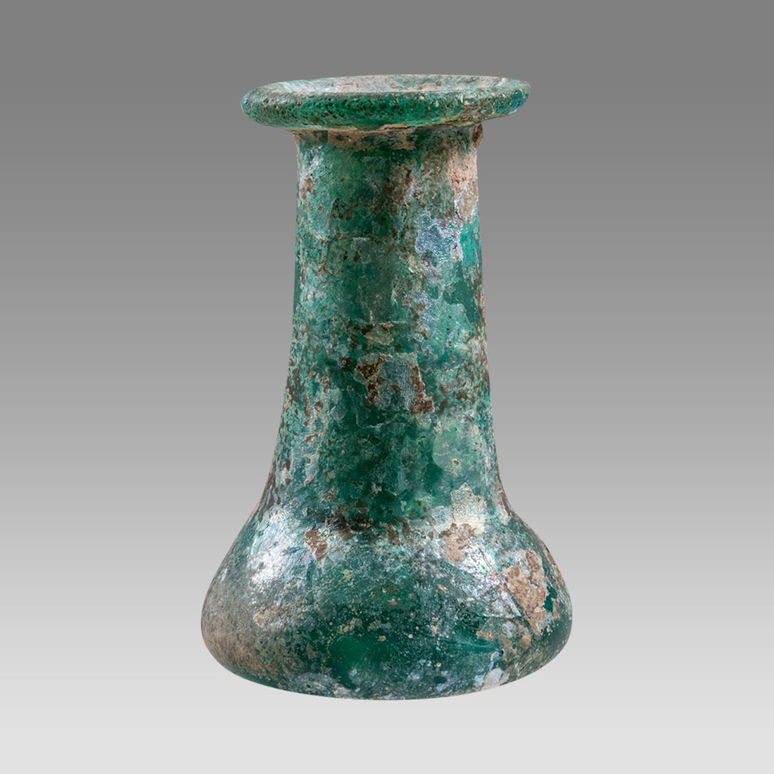 Ancient Islamic Glass Spool Shaped Bottle Ca. 6th-8th century A.D.: Ancient Islamic Glass Spool Shaped Bottle Ca. 6th-8th century A.D. Size 3 1/8 inches high. NYC collection, ex. Norry collection, Rochester, NY, acquired 1980s.