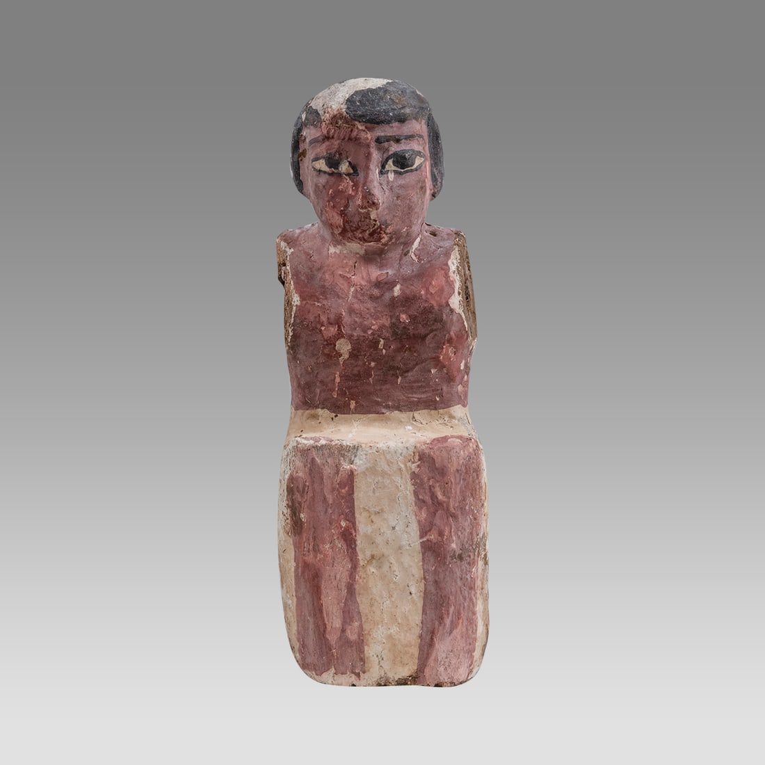 Ancient Egyptian Wooden Oarsman Tomb Figure. Egypt, Middle Kingdom, 2052-1778 BC.: Ancient Egyptian Wooden Oarsman Tomb Figure. Egypt, Middle Kingdom, 2052-1778 BC. Size 6.25 inches high. Painted wooden figure of seated rower wearing a white skirt (this figure would row the ship tra