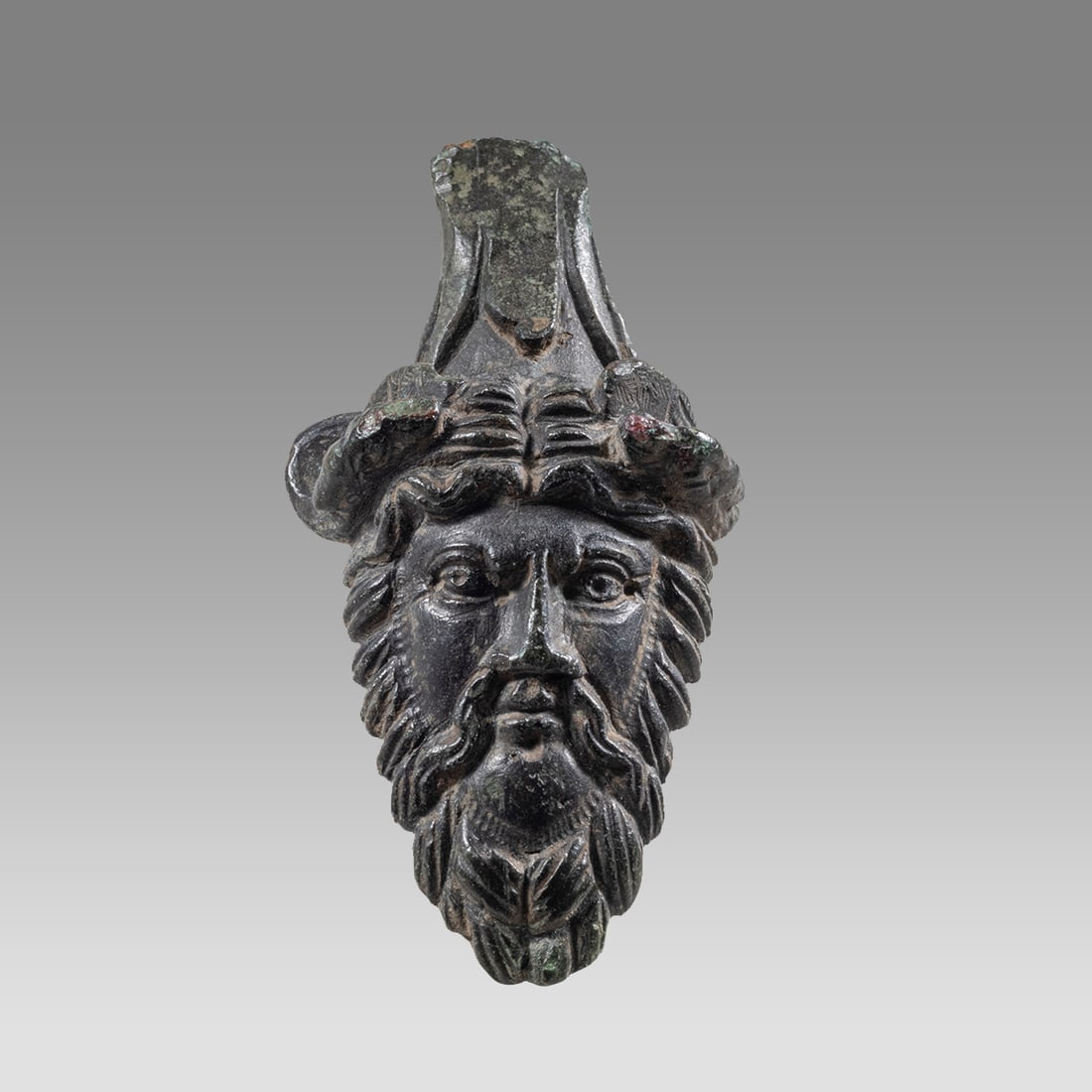Ancient Greek Thrace Bronze Mask Relief of Satyr c.350 BC.: Ancient Greek Thrace Bronze Mask Relief of Satyr c.350 BC. Size 2 1/4 inches high + stand. Fine cast bronze facing mask of satyr with long beard (from handle) . Fine quality with wonderful patina. mou