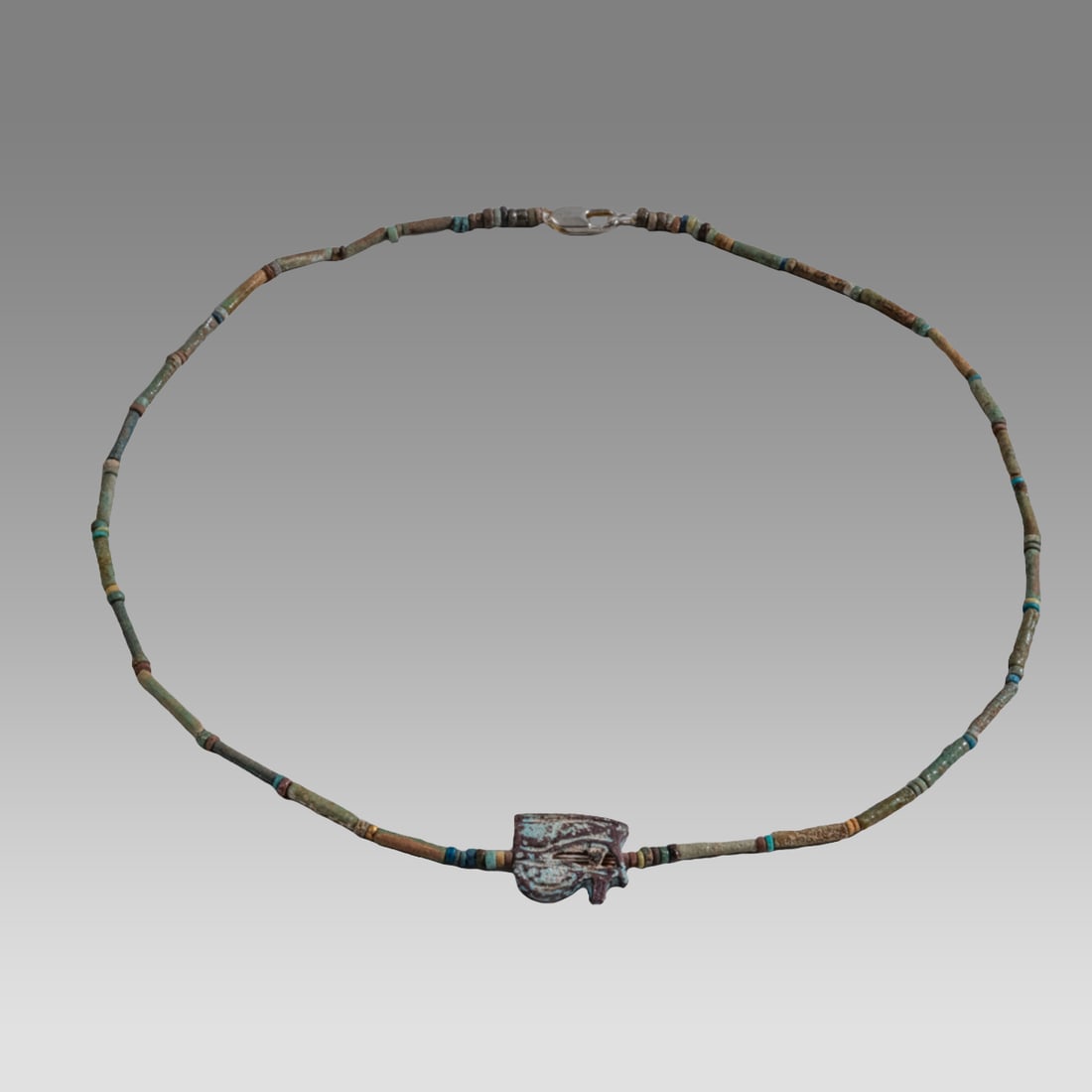 Ancient Egyptian Faience, Necklace c.300-50 BC.: Ancient Egyptian Faience, Necklace c.300-50 BC. Size 18 3/4 inches length. Great Looking single strand Faience Bead necklace with amulet. wearable. Provenance: Ex Secret Eyes Gallery New York 1970's-1