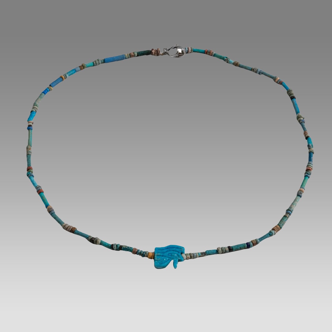 Ancient Egyptian Faience, Necklace c.300-50 BC.: Ancient Egyptian Faience, Necklace c.300-50 BC. Size 17 3/4 inches length. Great Looking single strand Faience Bead necklace with amulet. wearable. Provenance: Ex Secret Eyes Gallery New York 1970's-1