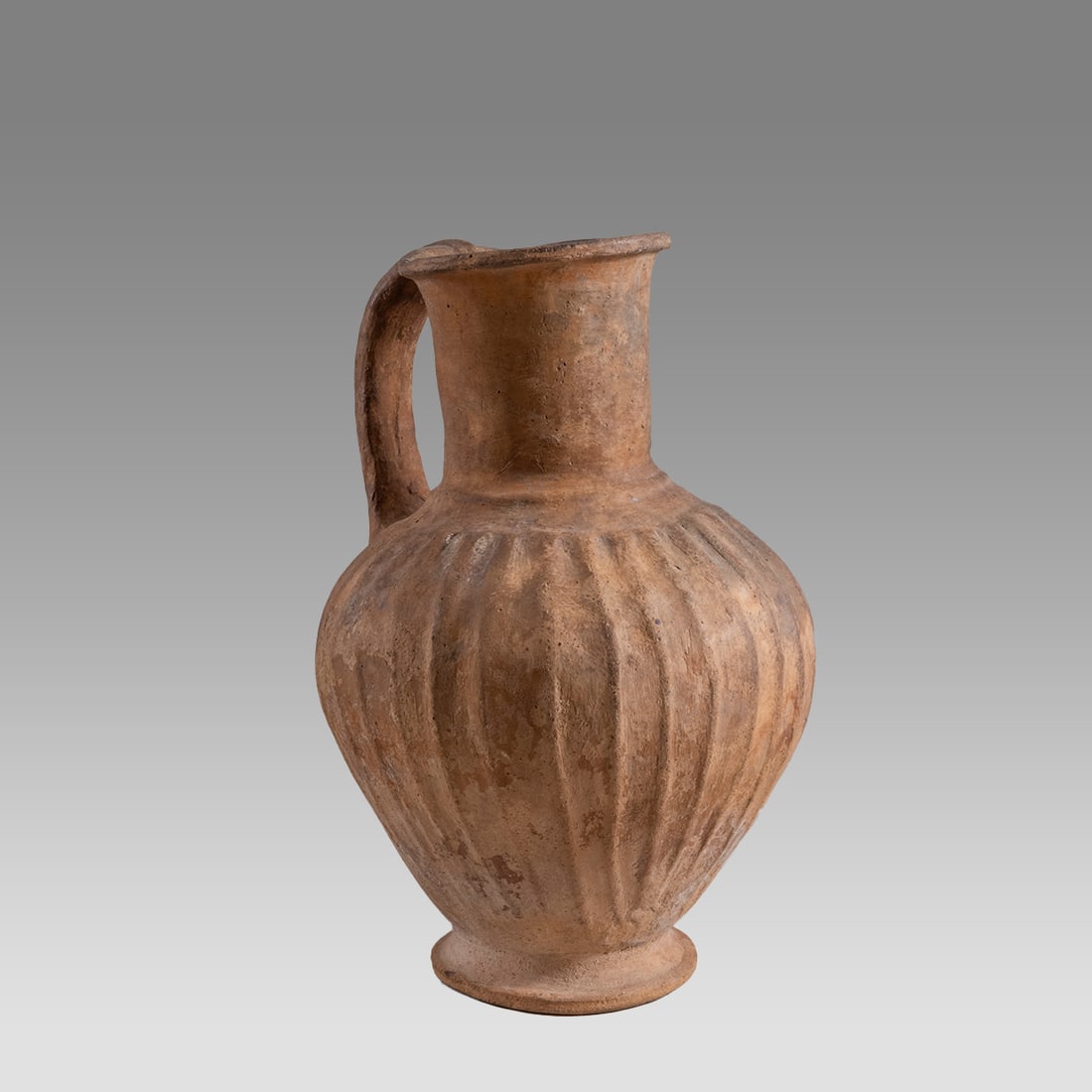 Ancient Terra Cotta Bottle - from Carthage, North Africa - Iron Age - ?? 800-600 BC-.: Ancient Terra Cotta Bottle - from Carthage, North Africa - Iron Age - ?? 800-600 BC-. Size 7 inches high. Beautiful ribbed design. Intact and almost perfect. Very rare to get these items from North Af